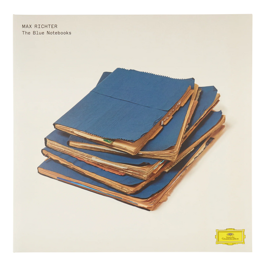 Album cover with stacked blue notebooks and text 'Max Richter The Blue Notebooks' on a beige background