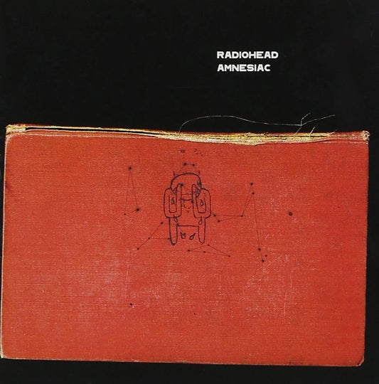 Album cover of 'Amnesiac' by Radiohead with a red textured surface and central design.